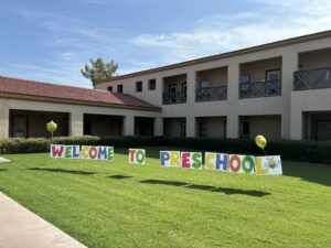 Welcome to Preschool sign in front yard of Church